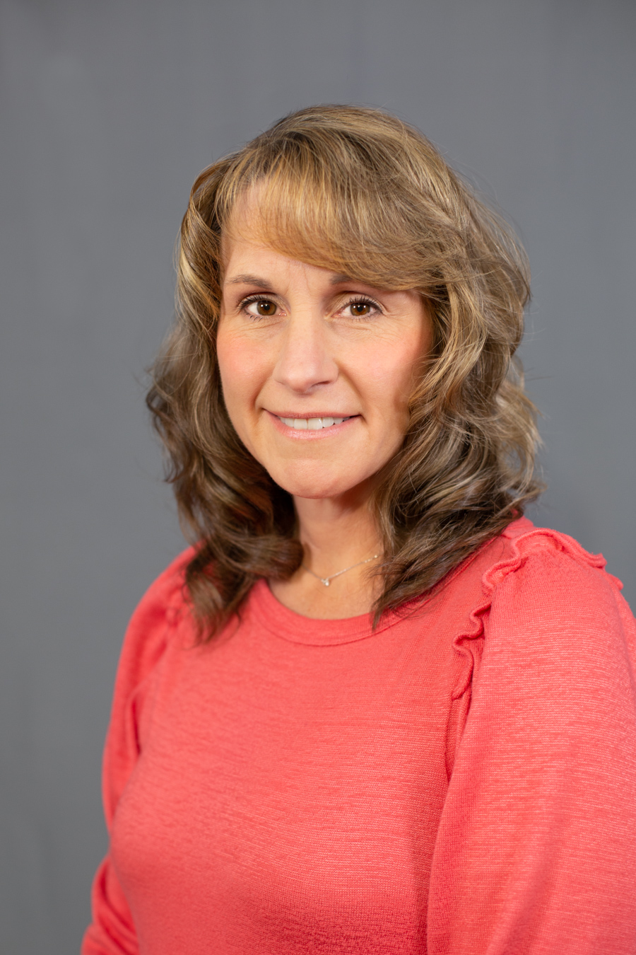 Beth Sampsell Smiling woman with grey background