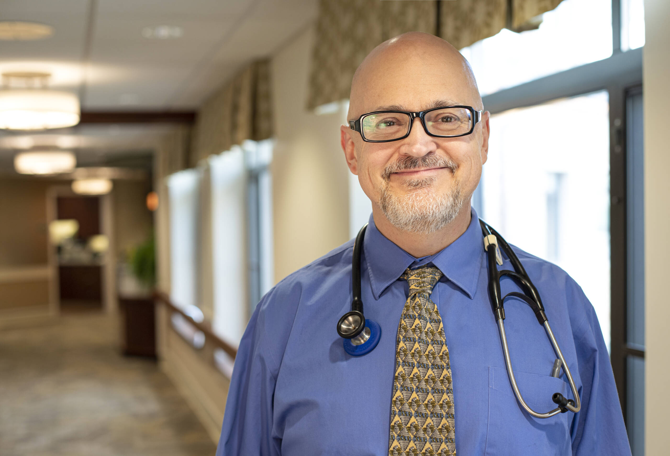 DrMast2020_horz Smiling man with stethoscope around his neck